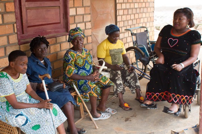 Cameroonians with disability wait for other attendees to show up so that a meeting could begin.
