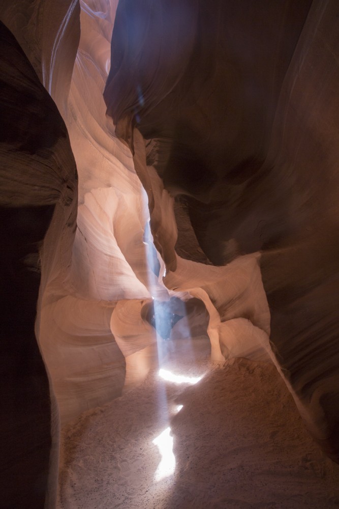 Antelope Canyon is a slot canyon that is known for its extraordinary lighting. As one walks through the Canyon, one can admire the different colors created by the light. 